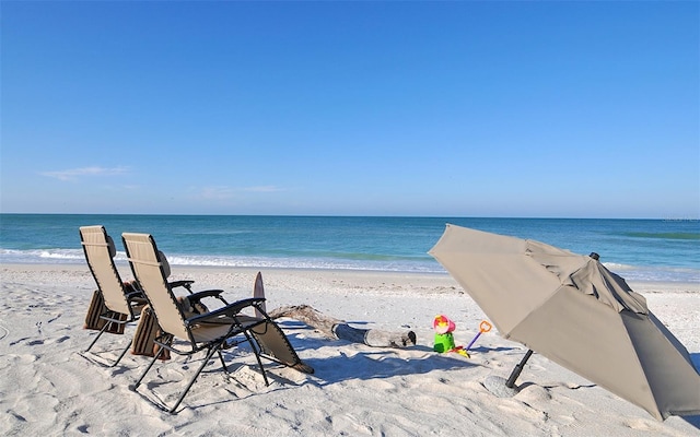 property view of water featuring a beach view