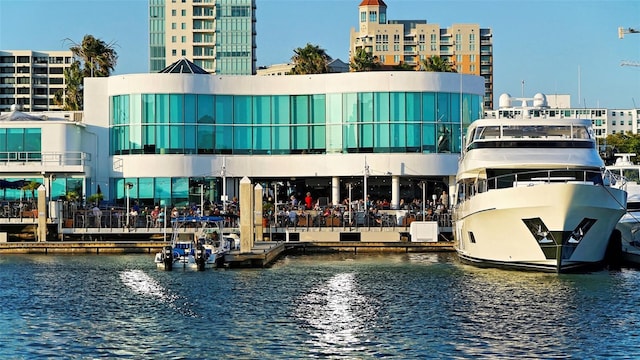 exterior space featuring a view of city and a water view