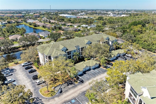 birds eye view of property featuring a residential view and a water view