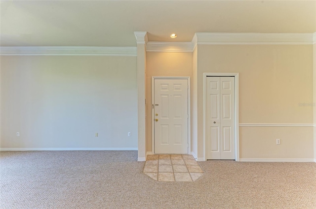 carpeted empty room featuring recessed lighting, crown molding, and baseboards