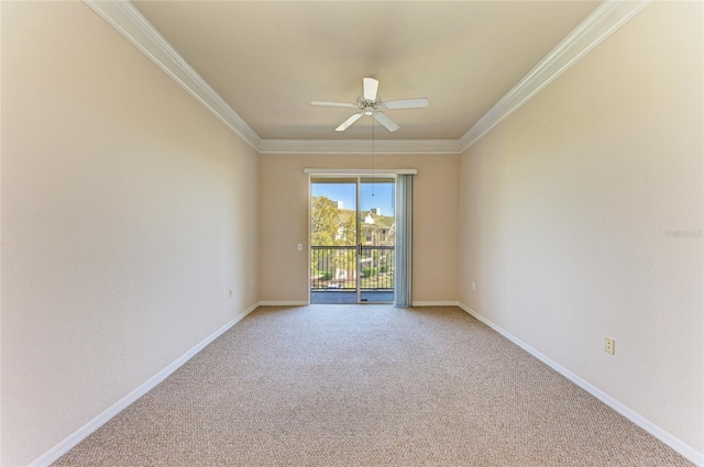 unfurnished room featuring a ceiling fan, carpet, crown molding, and baseboards