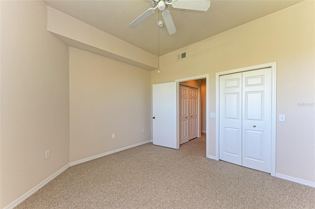 unfurnished bedroom with light carpet, baseboards, visible vents, and ceiling fan