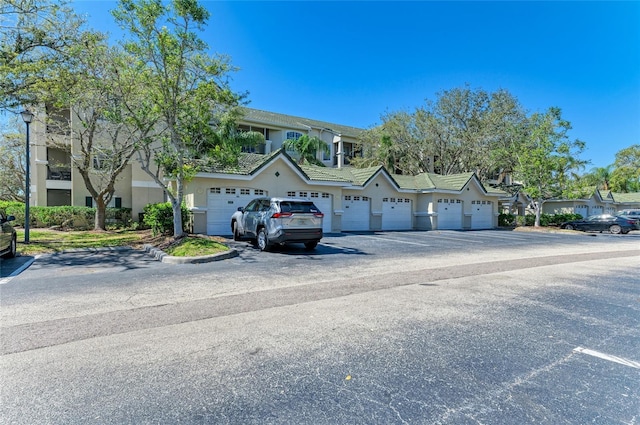 view of front of house featuring a residential view and community garages