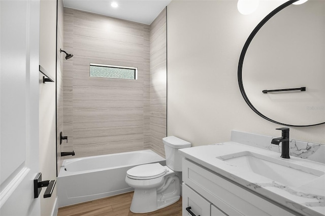 full bath with toilet, vanity, bathtub / shower combination, and wood finished floors