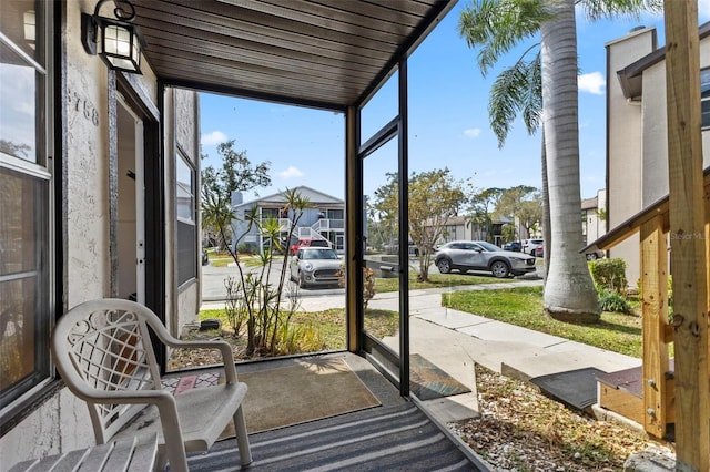 sunroom / solarium with a residential view