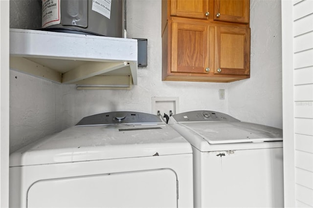 laundry room featuring cabinet space and washing machine and dryer