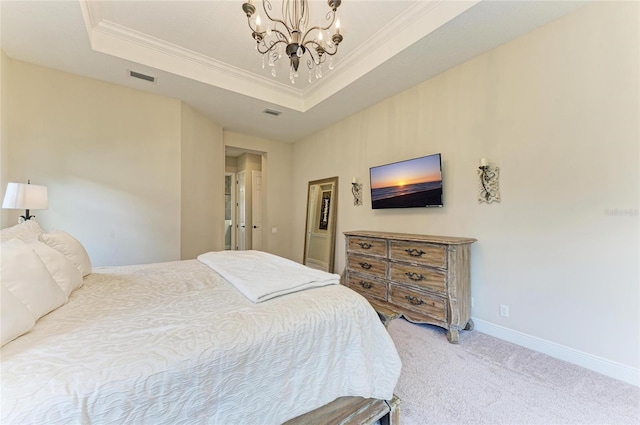 bedroom with a tray ceiling, carpet flooring, visible vents, and crown molding