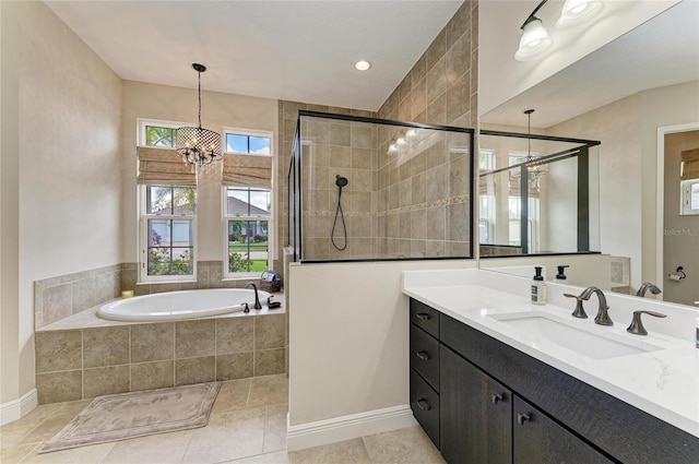 full bathroom featuring an inviting chandelier, tile patterned flooring, vanity, a shower stall, and a bath