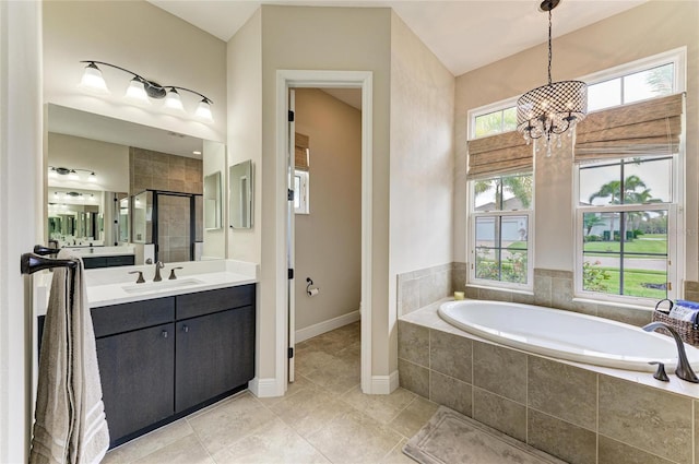 full bathroom featuring vanity, plenty of natural light, a shower stall, and a bath