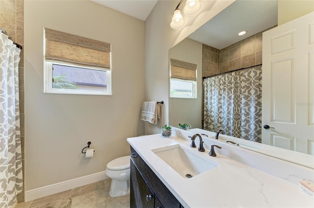 bathroom with a shower with shower curtain, toilet, vanity, and baseboards