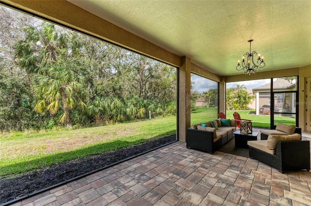 unfurnished sunroom with an inviting chandelier