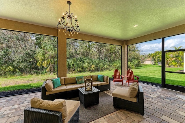 sunroom with a chandelier