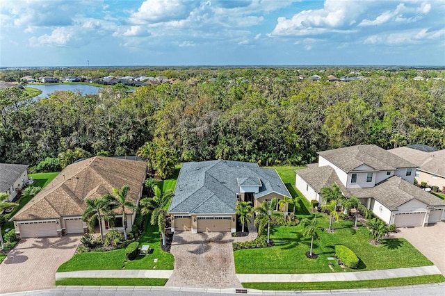 birds eye view of property featuring a residential view and a water view