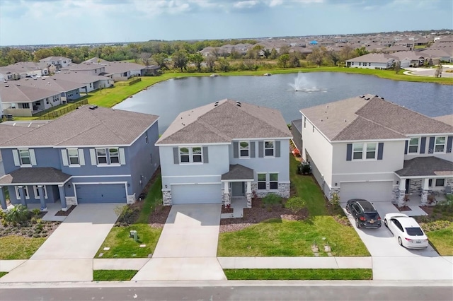 bird's eye view with a water view and a residential view