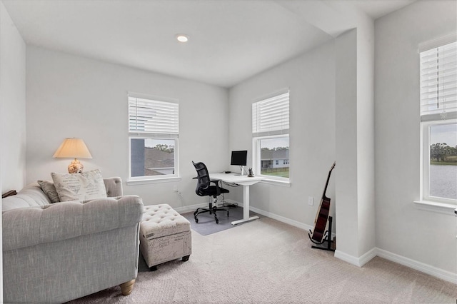 office featuring carpet, plenty of natural light, and baseboards