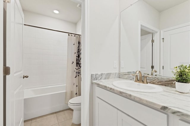 bathroom featuring shower / tub combo, vanity, toilet, and tile patterned floors