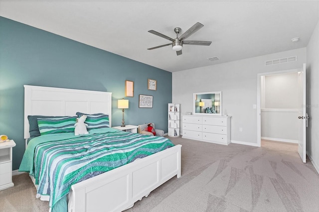 carpeted bedroom with ceiling fan, visible vents, and baseboards