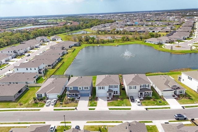 birds eye view of property featuring a water view and a residential view