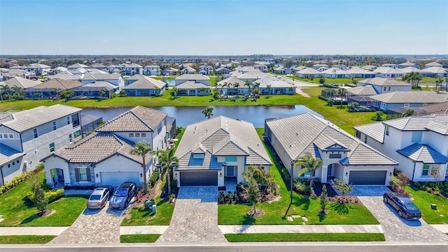 aerial view with a residential view and a water view