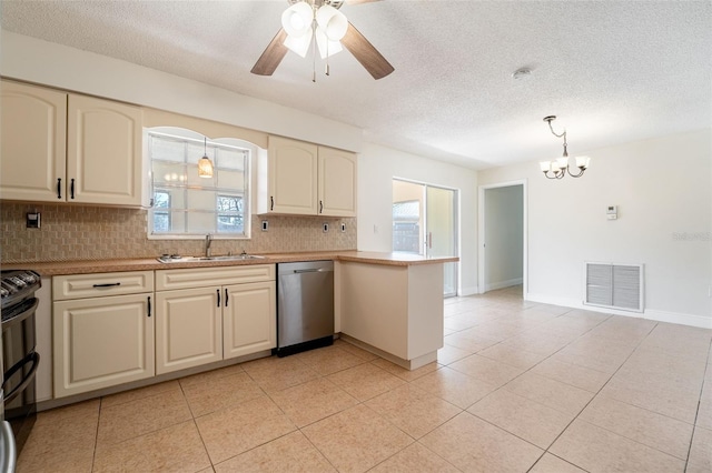 kitchen with a peninsula, a sink, visible vents, stainless steel dishwasher, and range