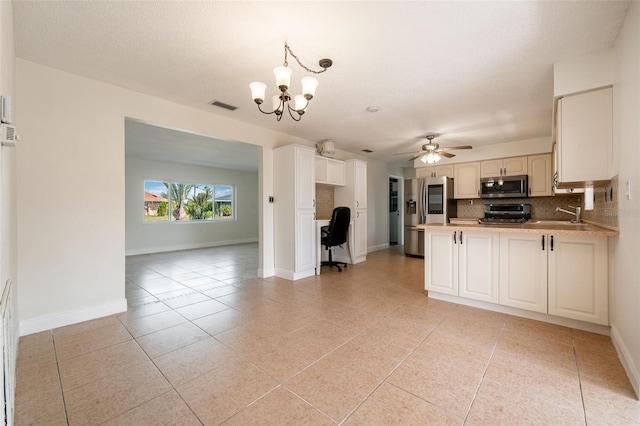 kitchen with light tile patterned floors, tasteful backsplash, visible vents, appliances with stainless steel finishes, and a peninsula