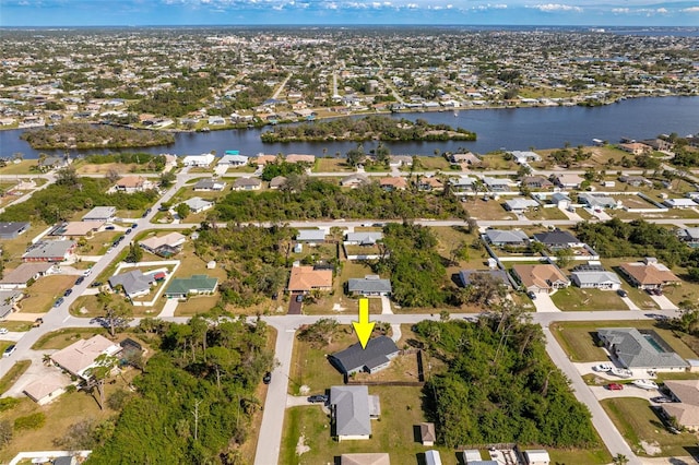 aerial view featuring a water view and a residential view