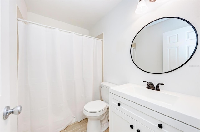 full bathroom featuring toilet, vanity, and curtained shower