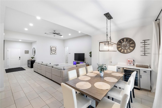 dining room with beverage cooler, ceiling fan, a dry bar, and recessed lighting