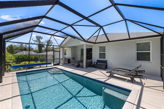 pool featuring a lanai, a patio area, and outdoor lounge area