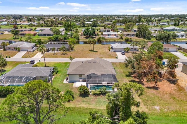 aerial view with a water view and a residential view