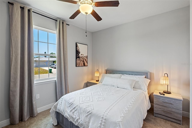 bedroom featuring carpet flooring, ceiling fan, and baseboards