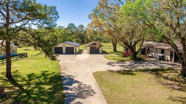 view of yard with a garage and fence