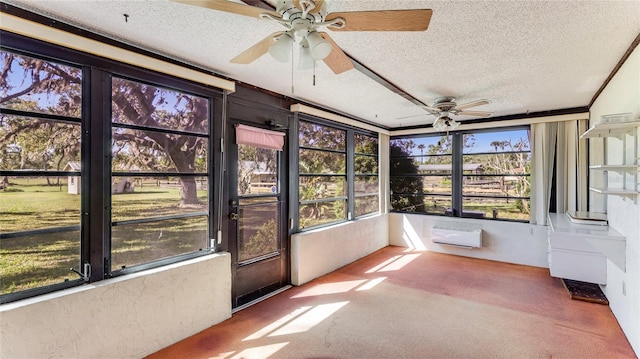 unfurnished sunroom with ceiling fan and a wall mounted AC