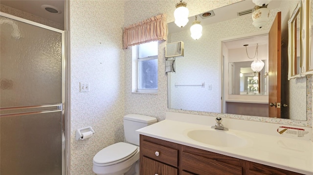 full bath featuring a stall shower, wallpapered walls, visible vents, toilet, and vanity