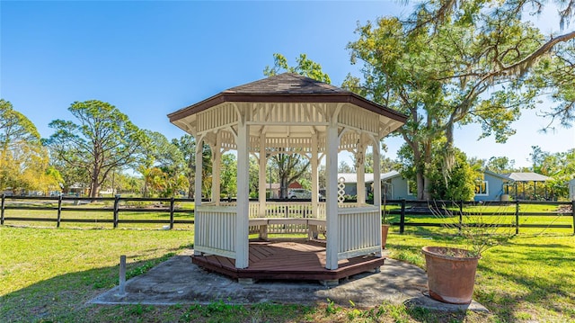 view of outdoor structure with fence and a gazebo