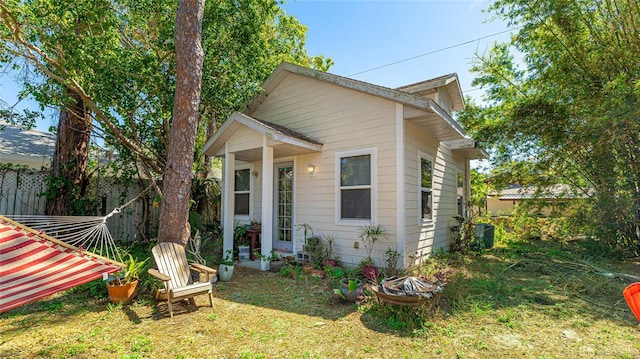 view of side of home with fence