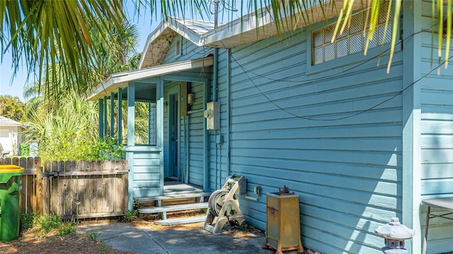 view of side of home with fence