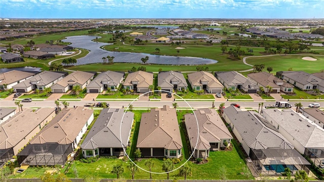 birds eye view of property with a residential view, view of golf course, and a water view