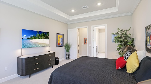 bedroom featuring crown molding, visible vents, a tray ceiling, and light colored carpet