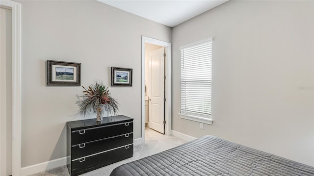 bedroom featuring carpet flooring and baseboards