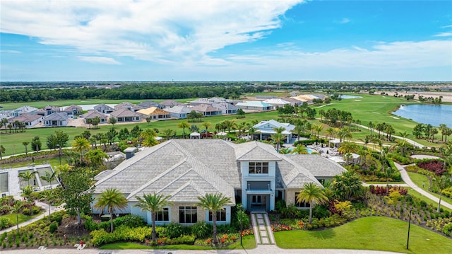 aerial view of residential area with a nearby body of water and a golf course