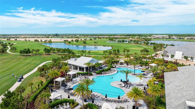 bird's eye view of a large body of water, a golf club, and a pool