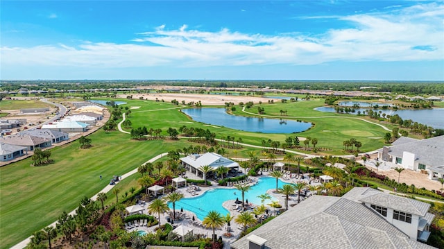 aerial view of a large body of water, a golf course, and a pool