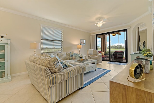 living area featuring ornamental molding, a ceiling fan, baseboards, and light tile patterned floors