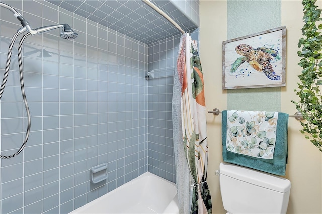 bathroom with shower / tub combo and toilet