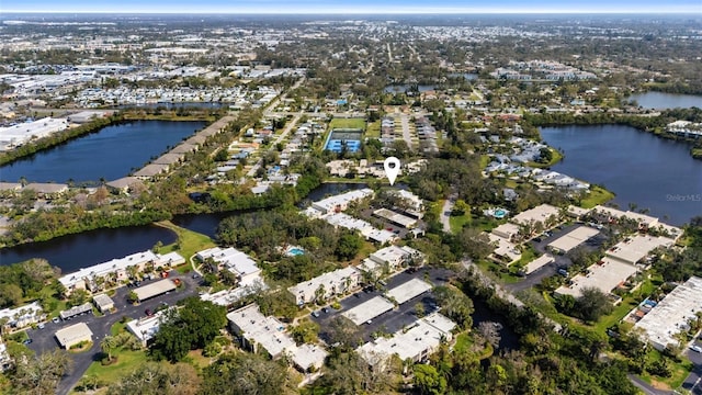 bird's eye view with a residential view and a water view