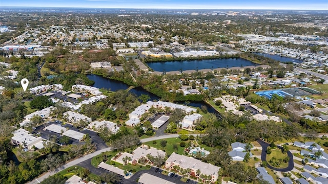 birds eye view of property with a water view and a residential view