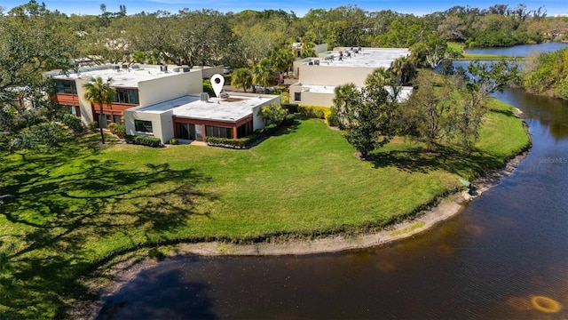 birds eye view of property with a water view