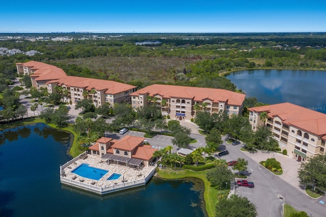 birds eye view of property with a water view