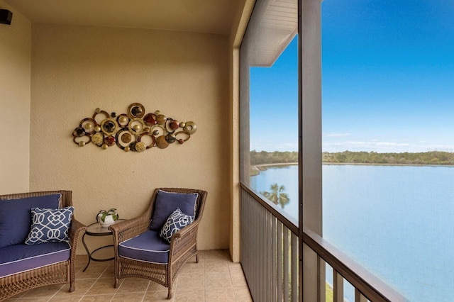 balcony featuring a water view